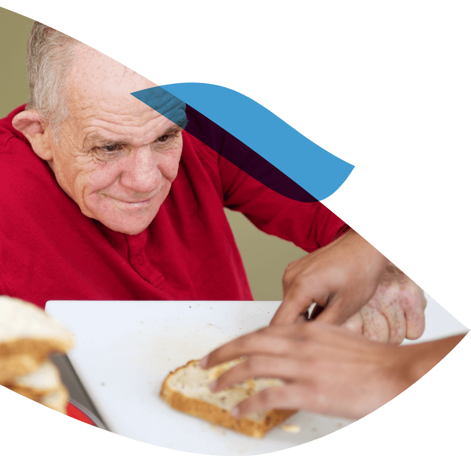 Old man reaching for his food